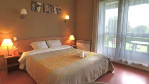 Ένα ή περισσότερα κρεβάτια σε δωμάτιο στο VVF Haute-Loire Les Estables