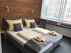 Postel nebo postele na pokoji v ubytování CREO Munich City