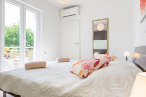 Postel nebo postele na pokoji v ubytování Apartments Windrose