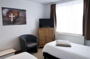 TV a/nebo společenská místnost v ubytování Hotel Halleux