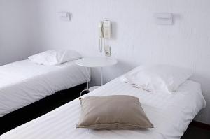 Postel nebo postele na pokoji v ubytování Hotel Halleux