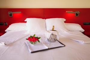 
a bed with two pillows and two pillows on it at Hotel Tximista in Estella
