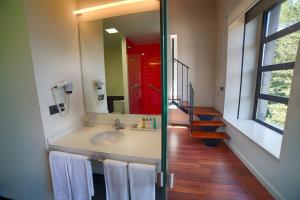 a bathroom with a sink and a mirror at Hotel Tximista in Estella