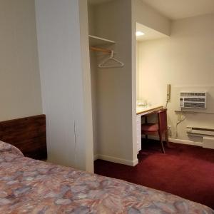 Postel nebo postele na pokoji v ubytování Greenwell Motel