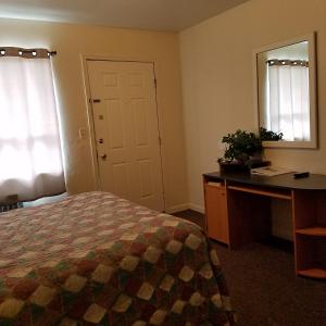 Postel nebo postele na pokoji v ubytování Greenwell Motel