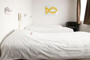 Postel nebo postele na pokoji v ubytování Hotel Halleux