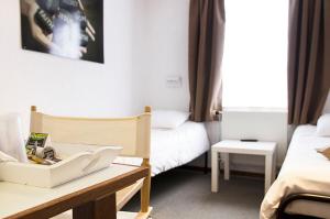 Postel nebo postele na pokoji v ubytování Hotel Halleux