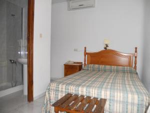 Postel nebo postele na pokoji v ubytování Hotel Paris