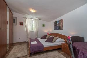 Postel nebo postele na pokoji v ubytování Apartments Mare Trogir