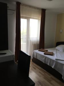 Postel nebo postele na pokoji v ubytování Vila DG + 13 fotografií