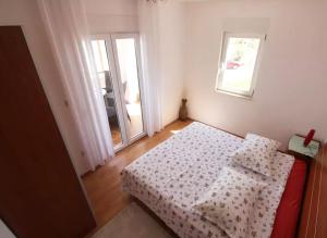 Postel nebo postele na pokoji v ubytování Beachfront Family Escape, Ciovo