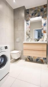 Koupelna v ubytování Rakowicka Apartment + 23 fotografií