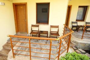 a group of chairs and a table on a patio at Dalyan Pension in Dalyan