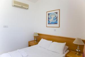 Postel nebo postele na pokoji v ubytování Eliofos Elegant Maisonettes
