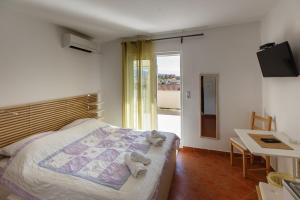 Postel nebo postele na pokoji v ubytování Apartments Maris + 10 fotografií