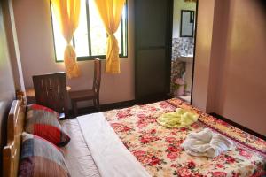 Postel nebo postele na pokoji v ubytování Banaue Greenfields Inn