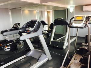 a gym with two tread machines and a treadmill at Hotel Celta in Guadalajara