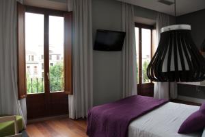 Ein Bett oder Betten in einem Zimmer der Unterkunft Khu Hotel