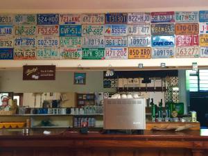 a bar in a restaurant with signs on the wall at Staigue Fort House in Caherdaniel