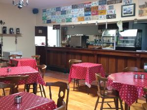 a restaurant with tables with red and white polka dots at Staigue Fort House in Caherdaniel +41 photos