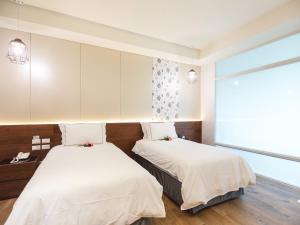 大埔硫磺温泉商务旅馆客房内的一张或多张床位
