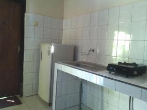 Kuchyň nebo kuchyňský kout v ubytování Indraprastha Ubud Home Stay