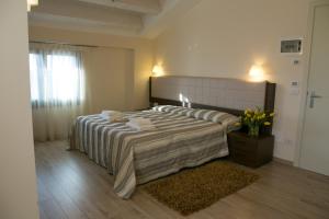 Postel nebo postele na pokoji v ubytování Hotel Calinferno + 37 fotografií