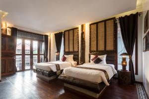 Postel nebo postele na pokoji v ubytování Khmer Paradise Villa + 37 fotografií