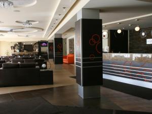 a lobby of a salon with couches and a bar at Hotel Elbrus Spa & Wellness in Szczyrk