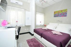 Postel nebo postele na pokoji v ubytování Apartmani Trogir