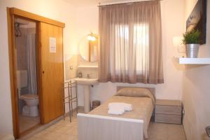 Koupelna v ubytování All'Etrusconia Hotel Castagneto Carducci + 37 fotografií
