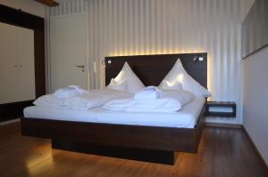 Letto o letti in una camera di Hotel Hagnauer Seeperle