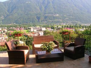 a balcony with chairs and a view of a mountain at B&B Al Carotin in Mantello