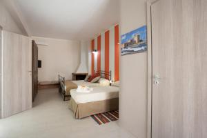 Postel nebo postele na pokoji v ubytování B&B Cinisi Mare e Monti