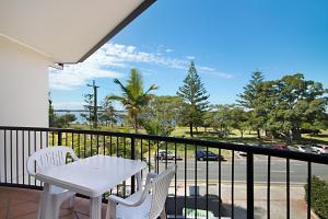 a balcony overlooking a beach with a view of the ocean at Blue Waters Apartments in Gold Coast