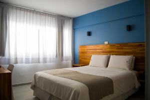 Cama ou camas em um quarto em Hotel Florinda