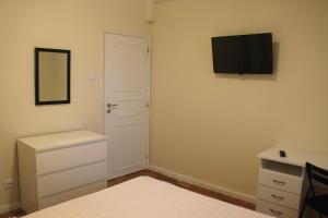 TV a/nebo společenská místnost v ubytování MicroRent Rooms