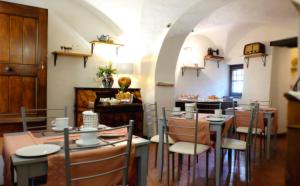 a dining room with a table and chairs at Dal Patriarca in Imperia