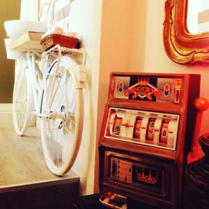 a bike parked against a wall next to a box of cigars at Jacuzzi Rooms in Rome