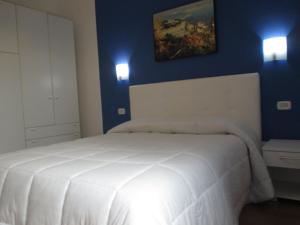 Posteľ alebo postele v izbe v ubytovaní Palinuro casa vacanze "Donna Antonia"