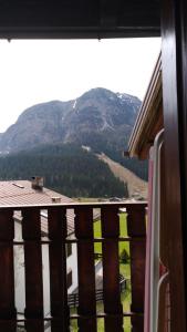 a view of a mountain from a window of a house at Appartamenti Kratter Valeria in Sappada