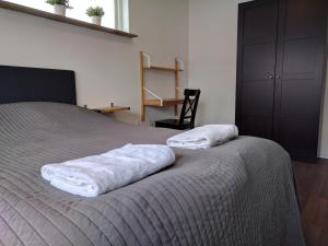 a bedroom with a bed with two pillows on it at Villa Copenhagen in Copenhagen