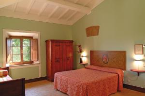 A bed or beds in a room at Poderi Arcangelo