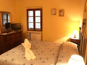 Posteľ alebo postele v izbe v ubytovaní Casa Ambra