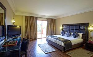 Postel nebo postele na pokoji v ubytování Palm Plaza Marrakech