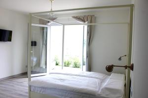 Postel nebo postele na pokoji v ubytování Oliveto