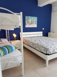 Posteľ alebo postele v izbe v ubytovaní Villa La Chiocciola