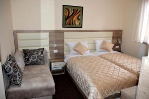 Ein Bett oder Betten in einem Zimmer der Unterkunft Hotel Čile