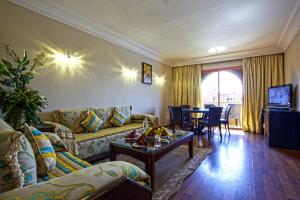 TV a/nebo společenská místnost v ubytování Palm Plaza Marrakech