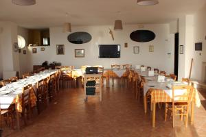a large dining room with tables and chairs at Residence Hotel Torresilvana in Vieste